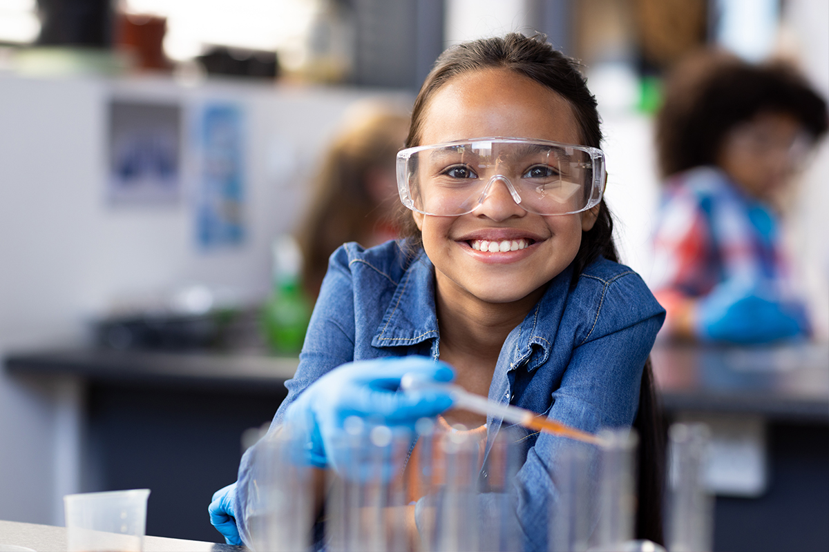 young girl doing science experiment